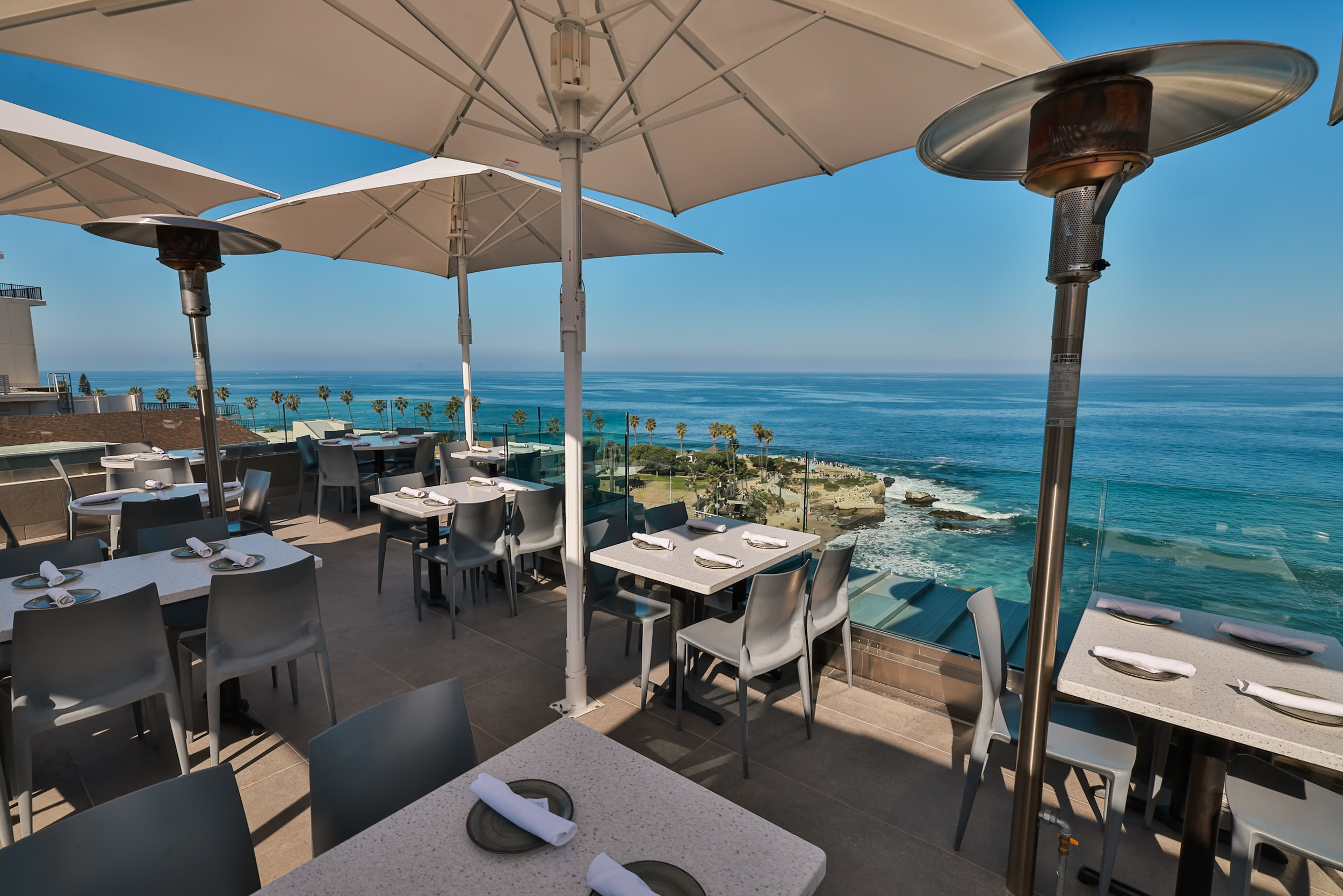 Ocean-view dining terrace at George’s at the Cove